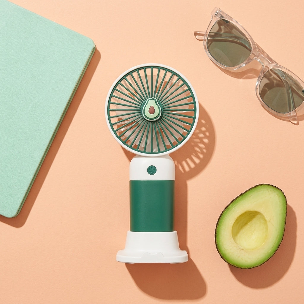 Portable fan with avocado design on a peach background